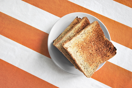 toasts with dish on tablecloth