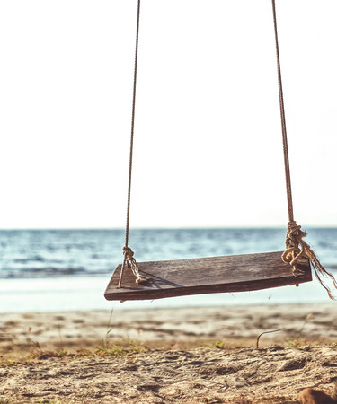 swing on the beach backgroundの写真素材