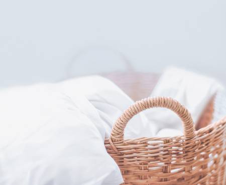 white fabric in the basketの写真素材