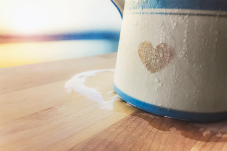 a cup of love, heart symbol cup and window lightの写真素材