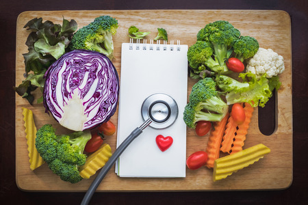 colorful vegetables and paper note with stethoscope on woodの写真素材