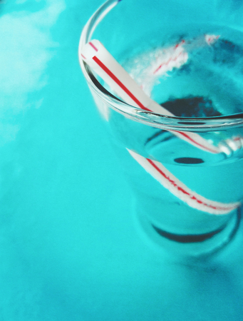 straw in a glass of water (retro color)