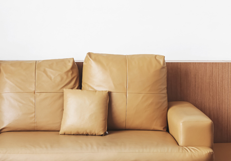 leather sofa on white wall backgroundの写真素材
