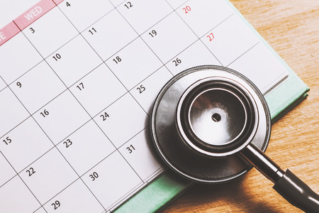 stethoscope on the calendar (doctor appointment)の写真素材