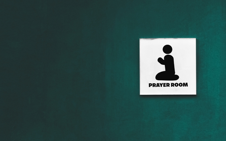 prayer room sign on the blue wall backgroundの写真素材