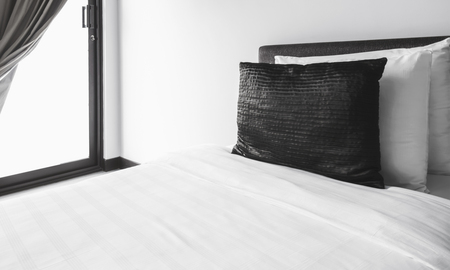 pillows on the white bedの写真素材