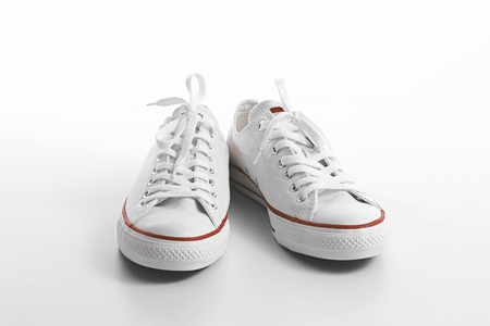 white sneakers on white backgroundの写真素材