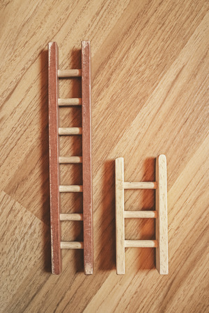 short and long wooden ladderの写真素材