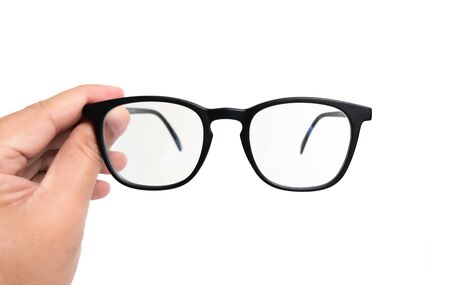 hand holding black eyewear over white backgroundの写真素材