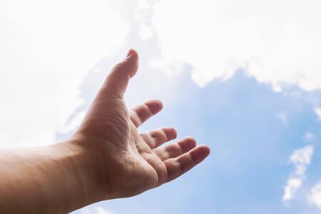 hand reaching to the sky background