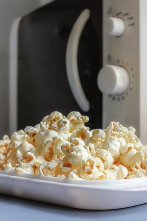 microwave popcorn on the dishの写真素材