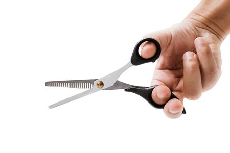hand holding hair scissors on white background