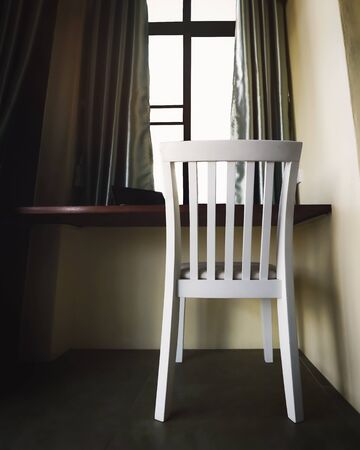 light through the window and chair in corner of living roomの写真素材