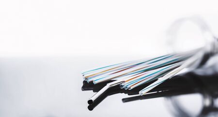eco metal drinking straw and plastic straw in glass jar with copy space background.の写真素材