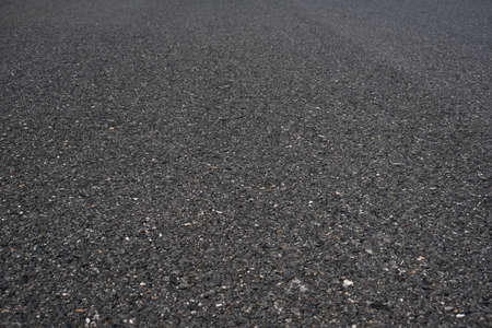 Asphalt road surface low angle background.の写真素材