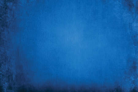 the abstract grunge dark blue background. the texture and rough scratch of the stucco wall backdrop.