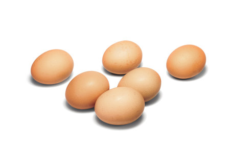 group of raw chicken eggs on white background. organic ingredient for cooking. protein food and nutrition concept.の写真素材