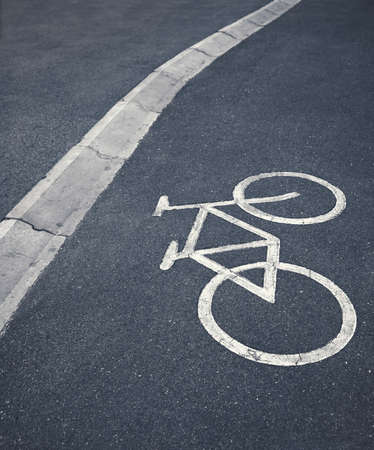 Bicycle lane sign separating city pedestrians. Exercise in urban parks.の写真素材