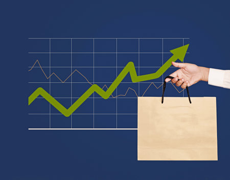 Moderate inflation and consumer spending. Personal Consumption Expenditures price index. Economic growth. Hand holding shopping bag and business graph on background.の写真素材