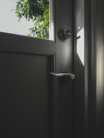 House handle door and lock. The morning sunlight shines through the window of the door of the house. Home interior and architectural.の写真素材