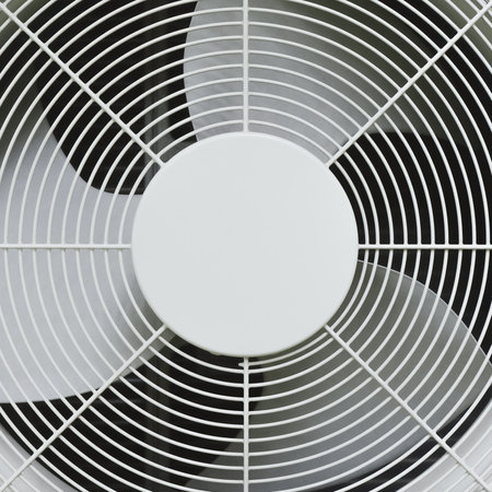 Cooling fan in the condensing unit of air conditioner. Air ventilation part. Steel symmetrical pattern. Industrial background.の写真素材