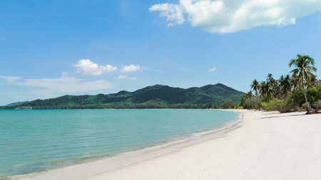 White sandy beach landscape with mountain view. Tropical beach travel. Summer trip.の写真素材