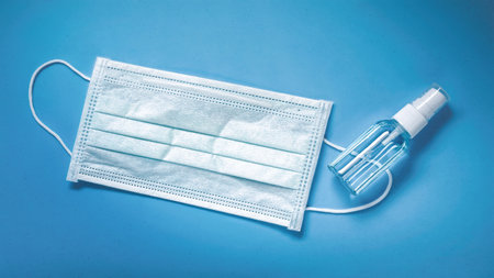 Face mask and alcohol spray to help curb spread of respiratory illnesses. Protection against virusâ in flu season.の写真素材