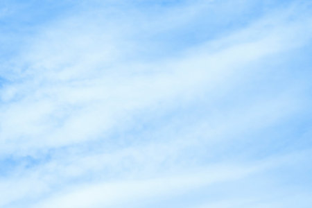 Cirrostratus clouds on blue sky background. Natural fluffy cloud. High cloudscape.の写真素材