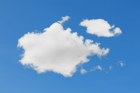 White soft fluffy cumulus cloud floating on blue sky background. Weather and meteorology concepts....