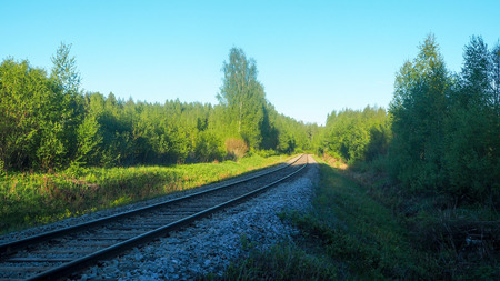 train track in rural finland close to the forestの写真素材