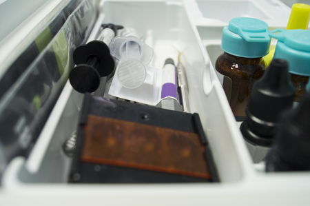 Instruments of the dentist syringes with medicine and painkillers in the stand backgroundの写真素材