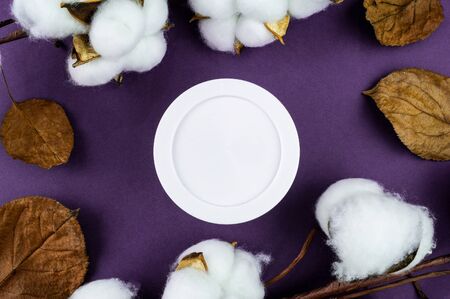 Jar of cream on a purple background. Mockup for your label. Natural cosmetics.の写真素材