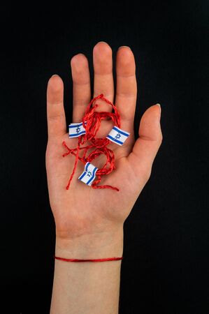 Red thread on a black background in the cartの写真素材