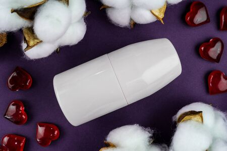 Mockup antiperspirant on a purple background. Cotton and heart-natural eco cosmetics.の写真素材