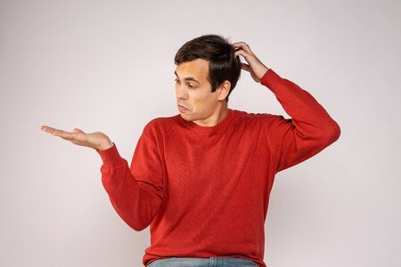 The guy in the red sweater points to his hand background