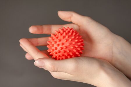 Conceptual image of a new deadly virus-coronavirus. Photo of hands on a gray backgroundの写真素材