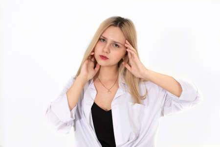 A girl in a white shirt and black t-shirt poses for the camera. Image on a white backgroundの写真素材
