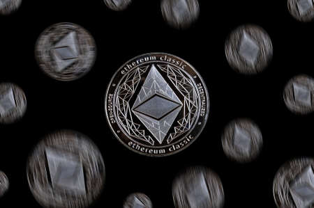 Coins ethereum classic fly and fall/ Photo on black backgroundの写真素材