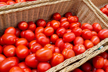 Ripe tomatoes are in the store in a drawer. close-up imageの写真素材