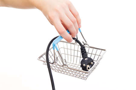 Girl holds a basket in which there is a power plug. concept image on a white backgroundの写真素材