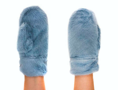 Mittens worn on a girl's hand. Isolated image on white backgroundの写真素材