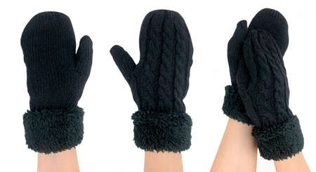 Mittens worn on a girl's hand. Isolated image on white backgroundの写真素材
