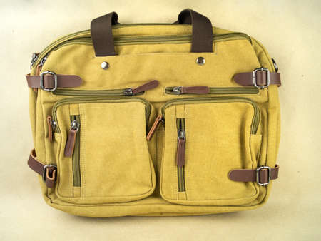 A beautiful hiking backpack is on the table. Photo on a background of craft paperの写真素材