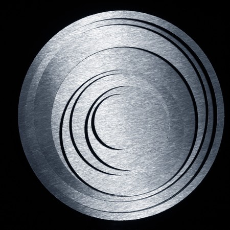 round metal concentric circles on a black background の写真素材