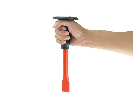 Hand holding chisel for concrete work isolated on white background.