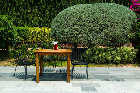 Chairs and table in garden.の写真素材