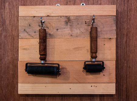 Classic roller hanging on wooden wallの写真素材