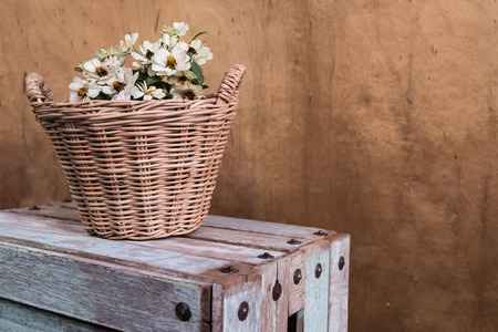 Flowers in wicker basket decorated vintage styleの写真素材