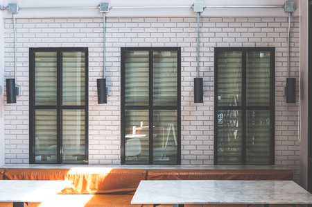 Modern cafe interior with gray brick wallのeditorial素材