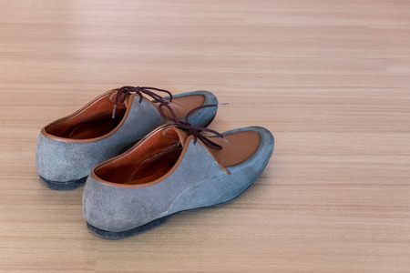 Leather shoe on wooden floorの写真素材